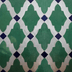 Moroccan zellige lattice mosaic detail in aqua white and navy blue hand cut tiles artisan craftsmanship